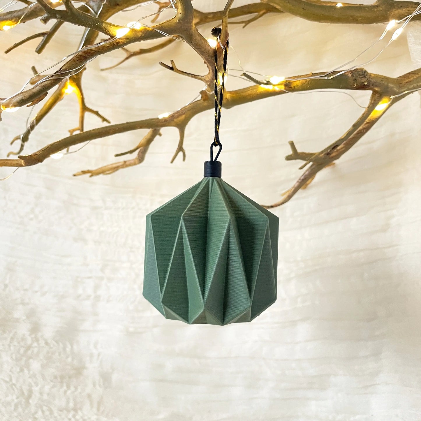 Matcha Green Crown origami ornament on Christmas tree or wreath, modern Japandi geometric holiday decor by Sonnihaus