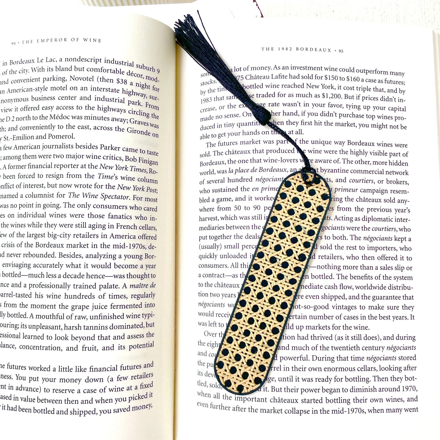 Black and beige COZI rattan textured bookmark with black tassel, modern minimalist reading accessory by Sonnihaus