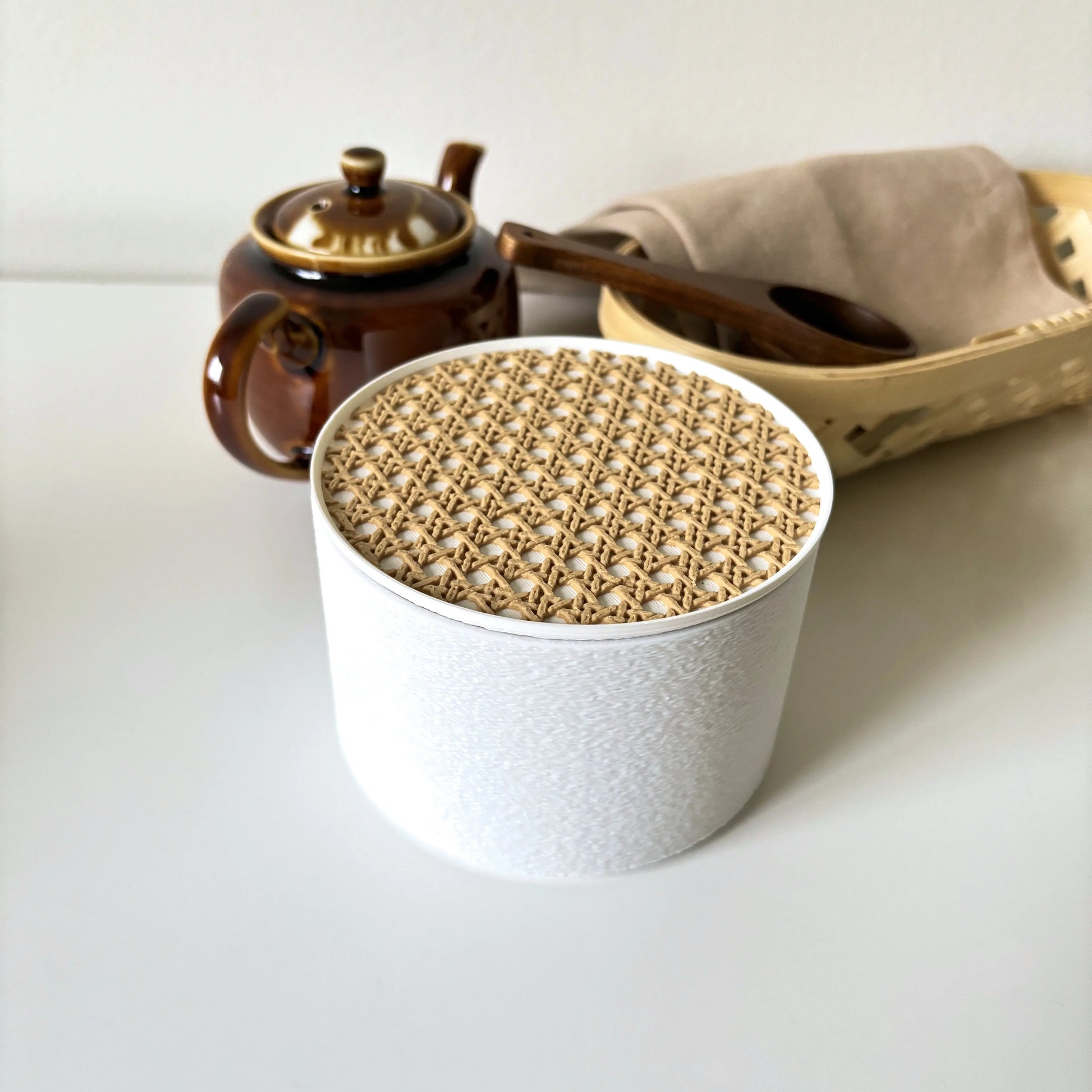 White COZI modern minimalist canister and beige rattan coaster set, coaster acts as lid for storage by Sonnihaus