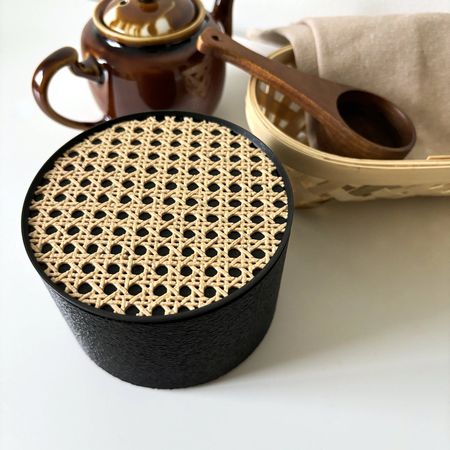 Black COZI modern minimalist canister and beige rattan coaster set, coaster acts as lid for storage by Sonnihaus